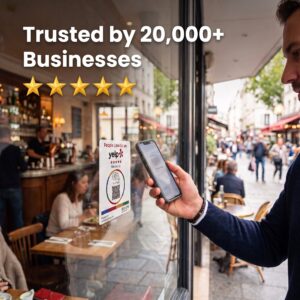 A customer tapping their phone on a Yelp review sticker on a storefront windows